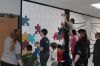 Underwood School’s Sixth Grade adds their touch to collaborative mural