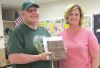 Larson receives cake and plaque service thanks